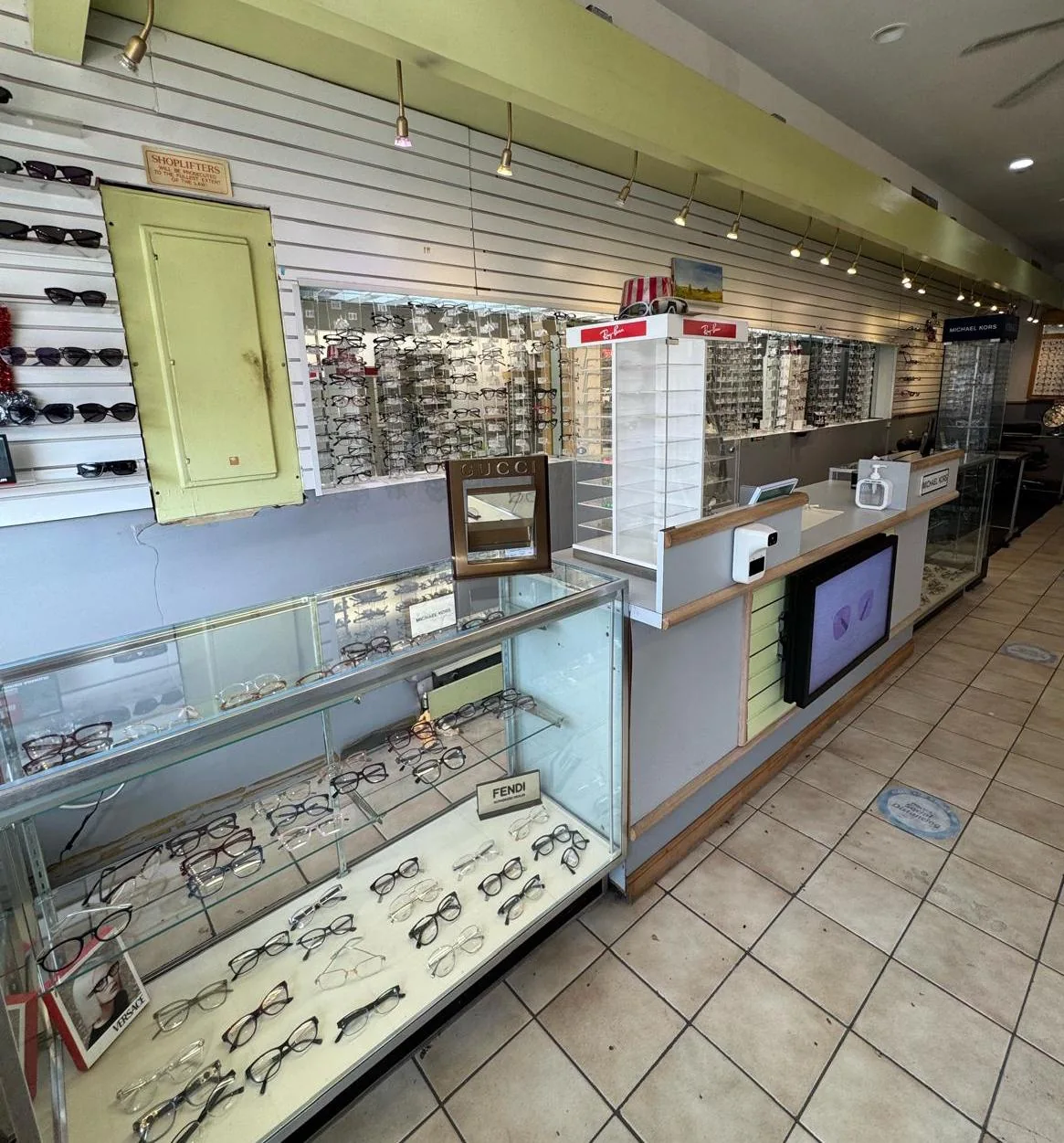Frame display cases inside Grand Spectacle Opticians