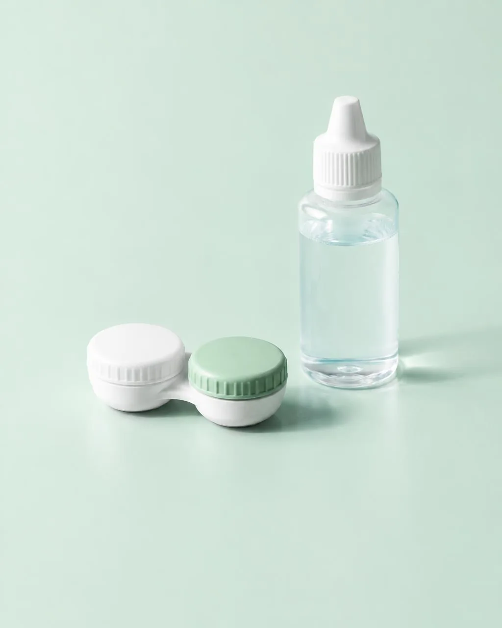 Contact lens case and solution on a mint surface